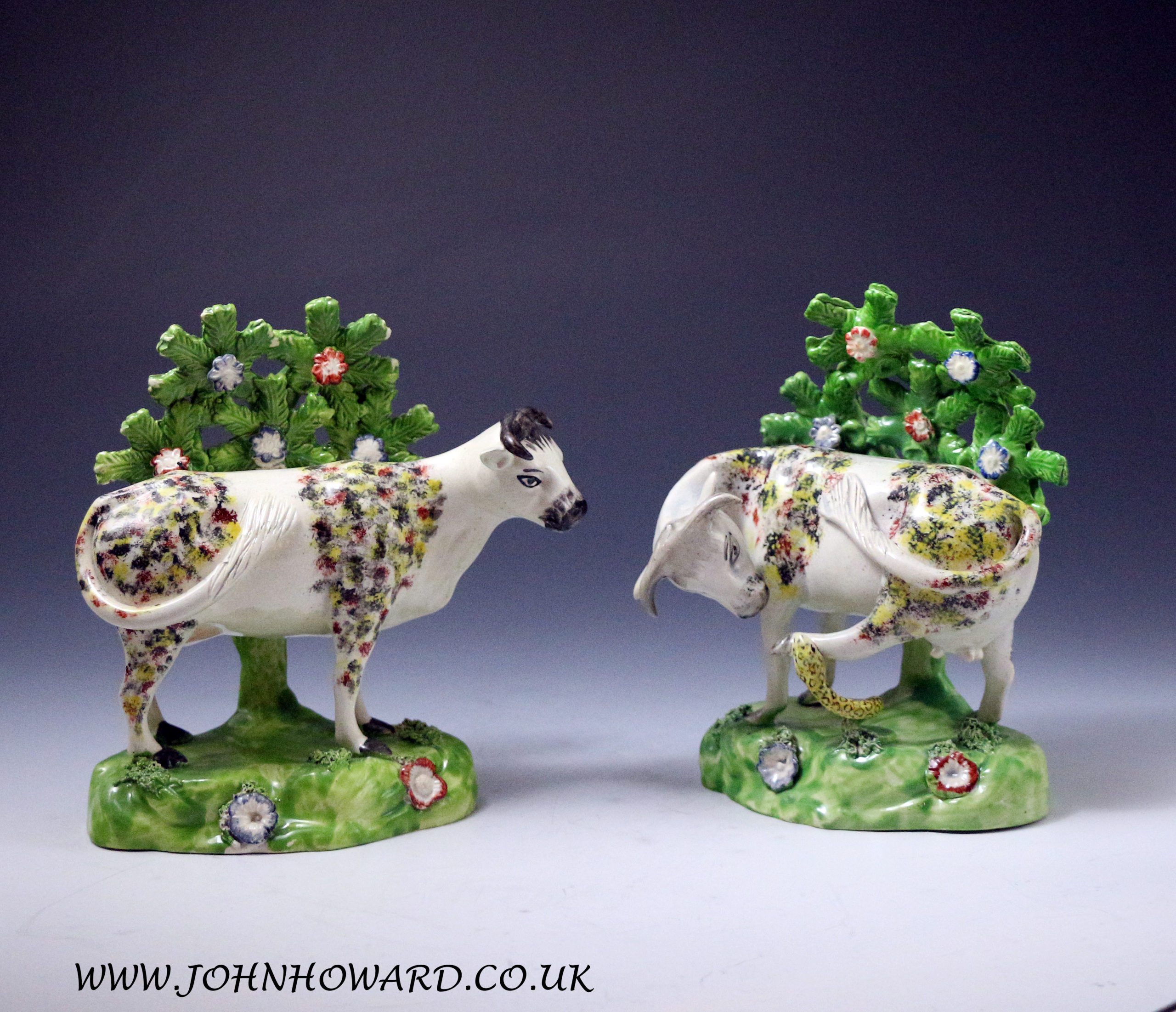 Staffordshire pottery pair of figures with bocage of cows early