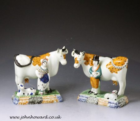 Pair of antique Yorkshire pottery prattware cows with attendants, Mexborough Pottery.