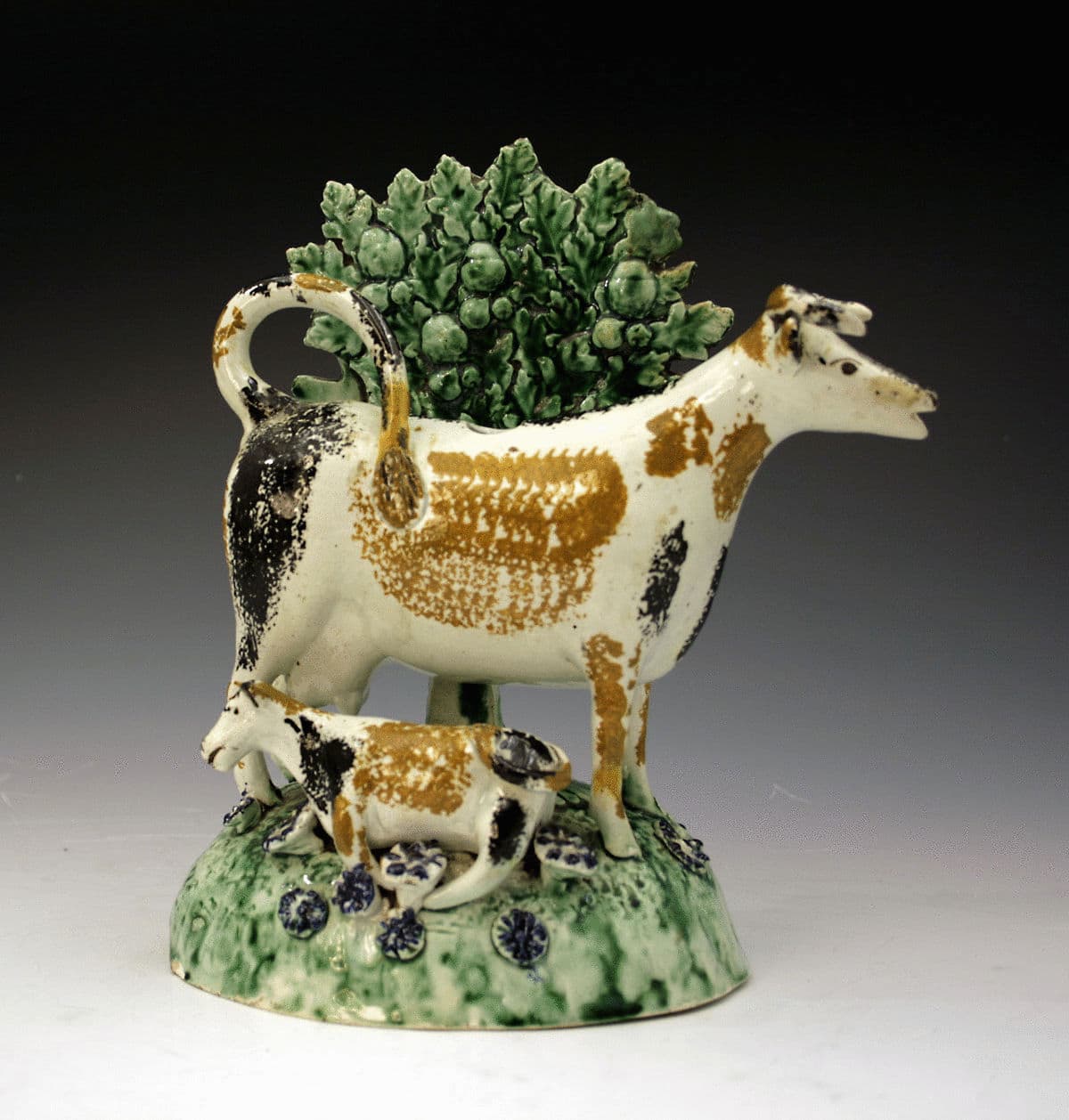 Antique pratt coloured cow creamer with bocage, Staffordshire or 