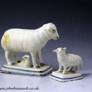 Antique English pottery figures of a ewe and lambs early 19th century.