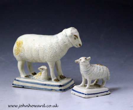 Antique English pottery figures of a ewe and lambs early 19th century.