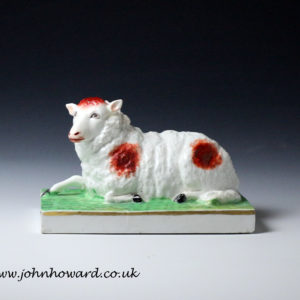 Staffordshire figure of a ewe on oblong base, English early 19th century period