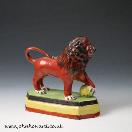 Staffordshire pottery pearlware figure ofa standing lion on base , English ceramic early 19th century