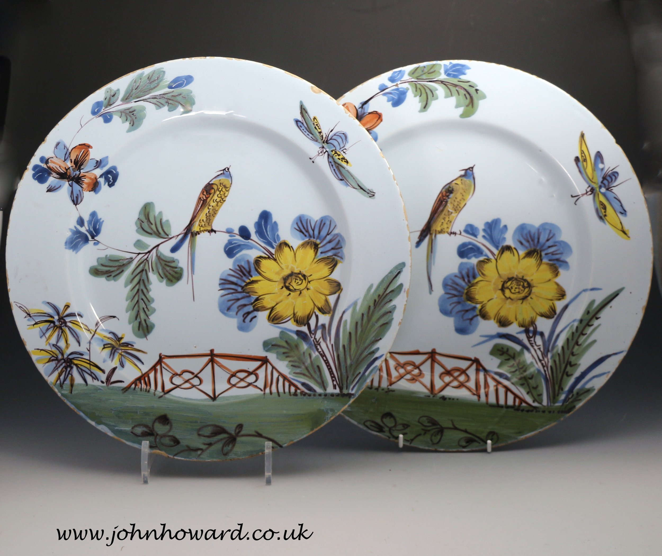 Download The pair of Delftware pottery chargers are polychrome decorated with images of bird perched in ...