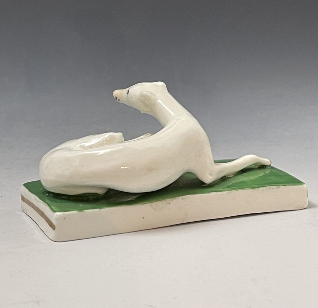 English porcelain model of a white greyhound on a green base circa 1830 ...