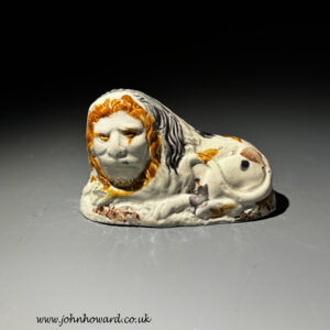 Staffordshire pottery figure of a lion with the face of William Pitt circa 1795