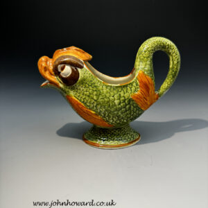 Staffordshire pottery Pratt ware sauce boat in the form a dolphin circa 1800